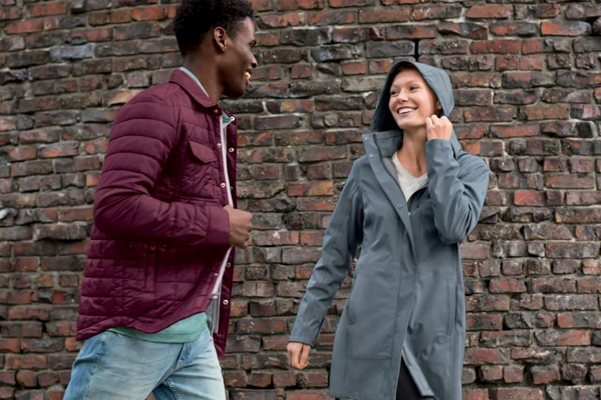 Man wearing Cutter & Buck Rainier Eco Puffer Shirt Jacket and Woman wearing Cutter & Buck Shield Jacket